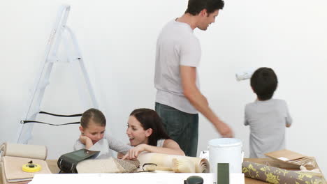 happy family painting a room