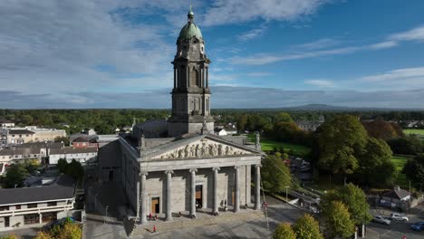 aerial view of a grand stone cathedral in a city