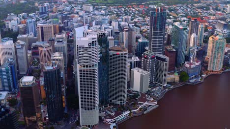 aerial view of riparian plaza skyscraper and other high rise buildings at the riverside in brisbane cbd, queensland - drone shot