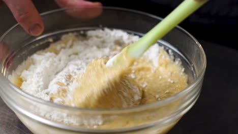 Stirring-pudding-in-a-glass-bowl-in-slow-motion