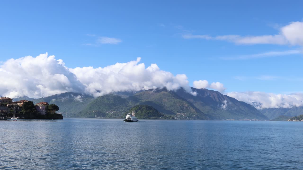 Ferry crossing Lake Como in Italy, establishing wide landscape