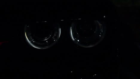 muscle car headlights reflecting flashing police lights