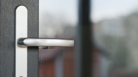 a hand in a protective glove opens the door behind the door