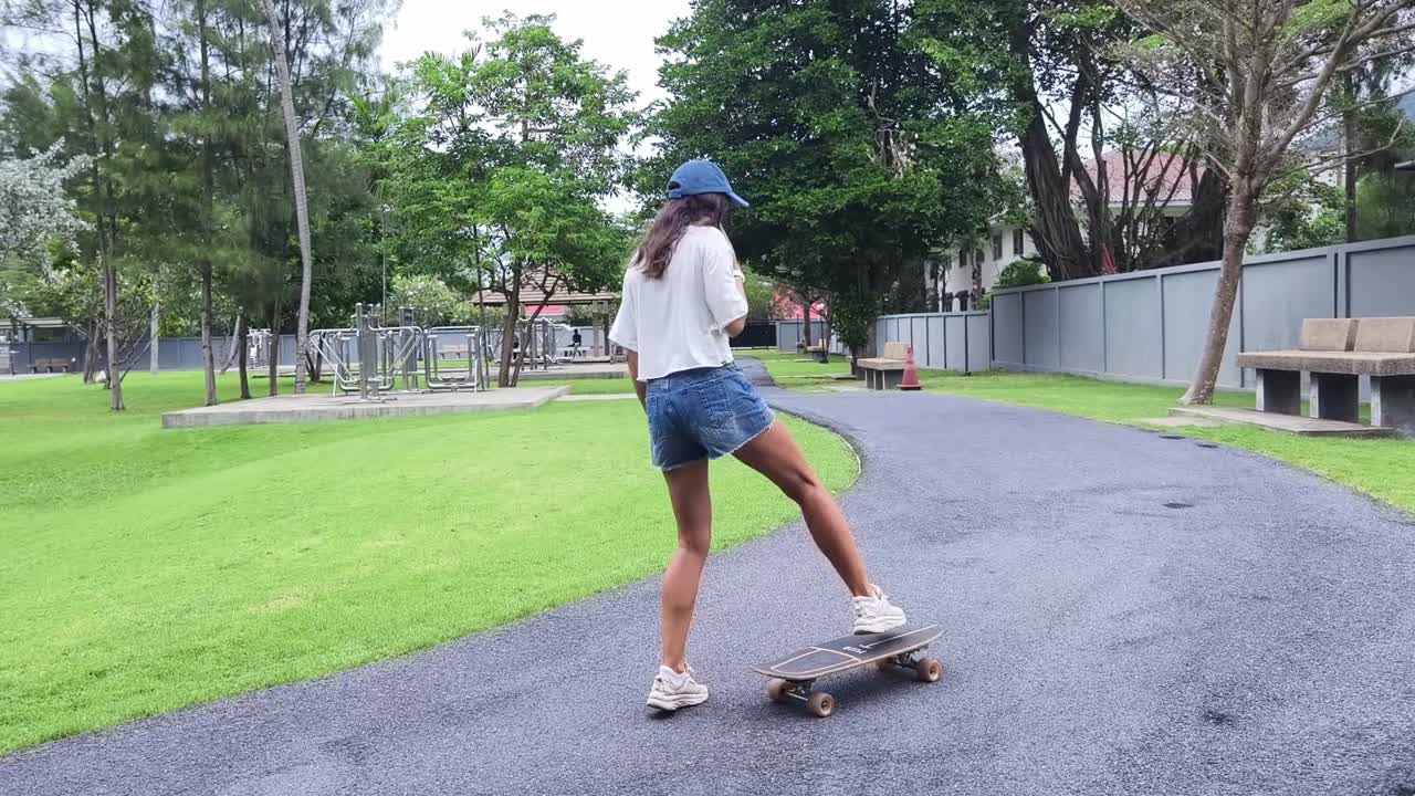 Woman Skateboarding in Park
