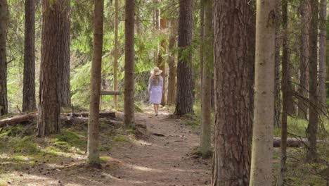 Spiritless-bored-maid-searching-for-unexplored-places-in-Danish-woods