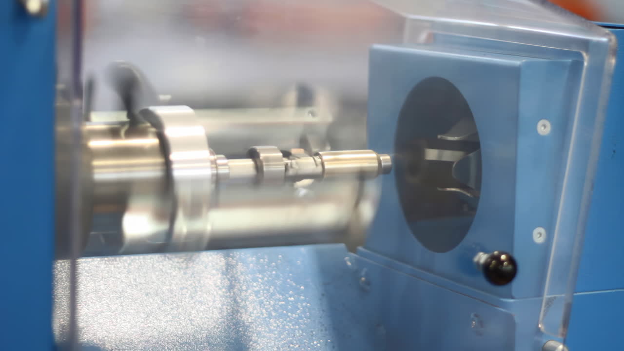 Technology Industrial robots in manufacturing plant produce auto parts. Modern machinery, engineering, heavy industry. Automated robotic arms metal parts on production line