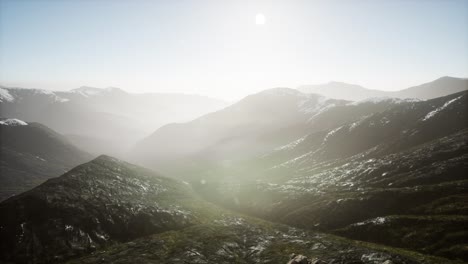 mountains in fog at sunset