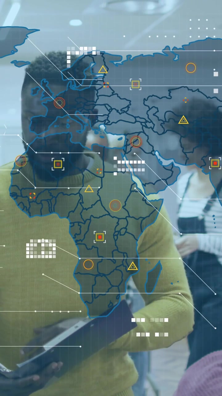 Animation of world map and icons over african american man working in office