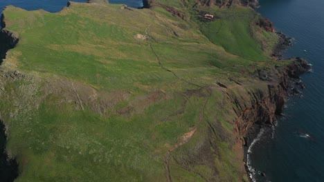 drone shot over the grass fields on the peninsula in madeira