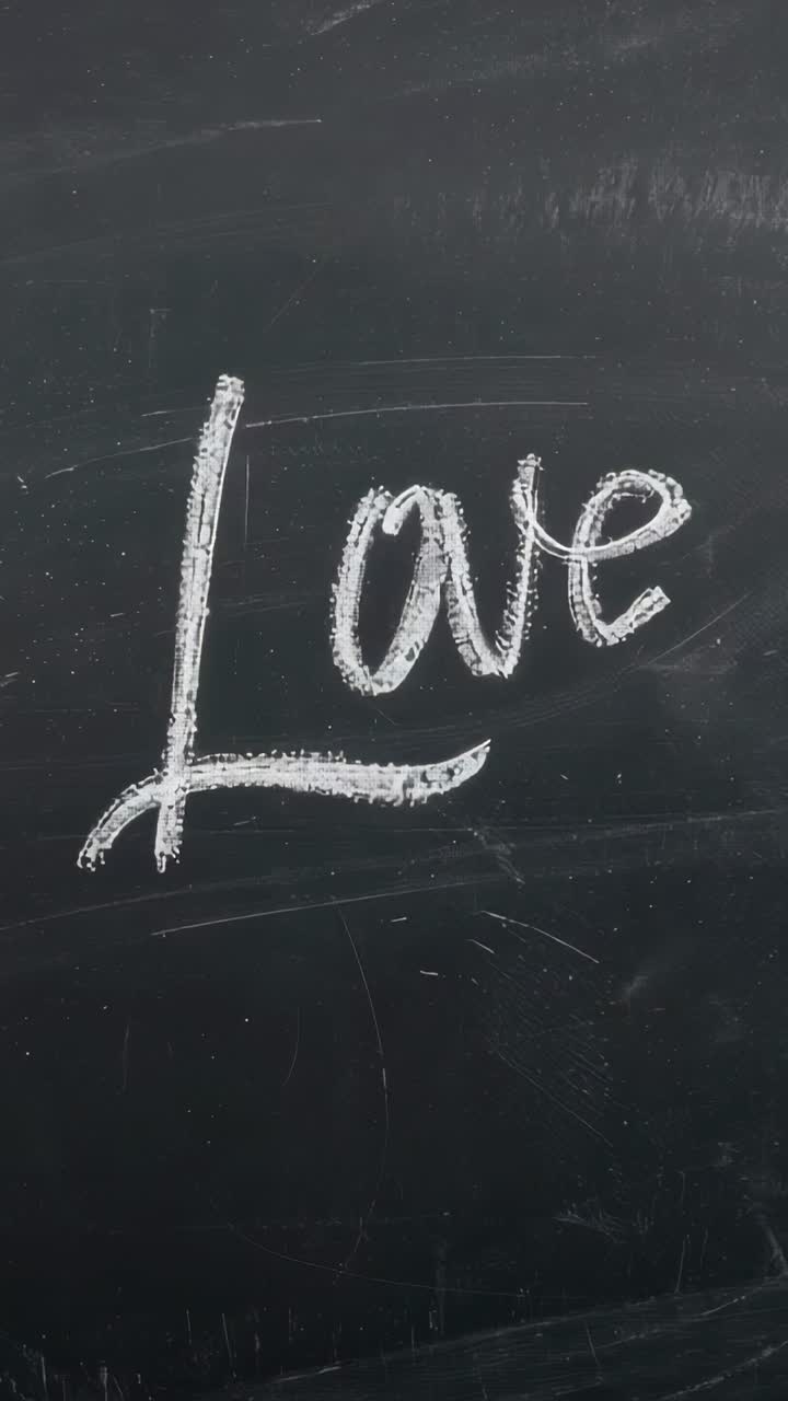 Vertical video: Sliding camera view revealing cafe chalkboard with white chalk Love and wooden trim