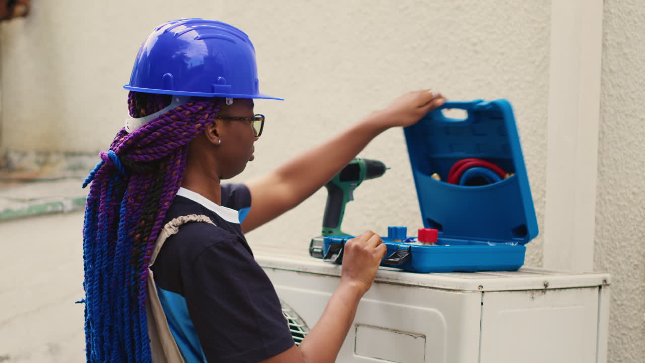 Worker prepares for condenser checkup