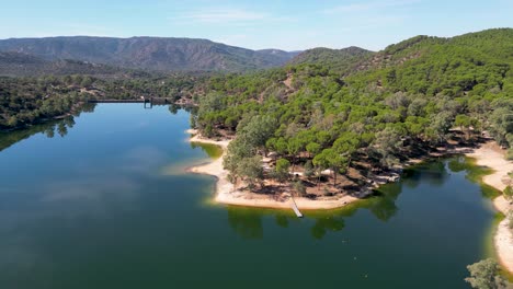 aerial view of encinarejo reservoir in mountain forests of sierra de andujar nature