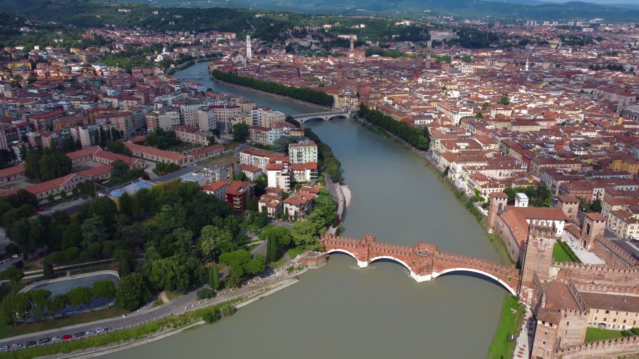 Cinematic aerial view overlooking wonderful city of Verona and Adige River, Italy