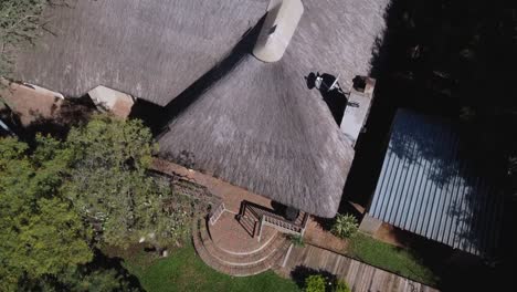 aerial bird's eye shot over accommodation outside of kruger national park, south africa on a bright sunny day during a trip