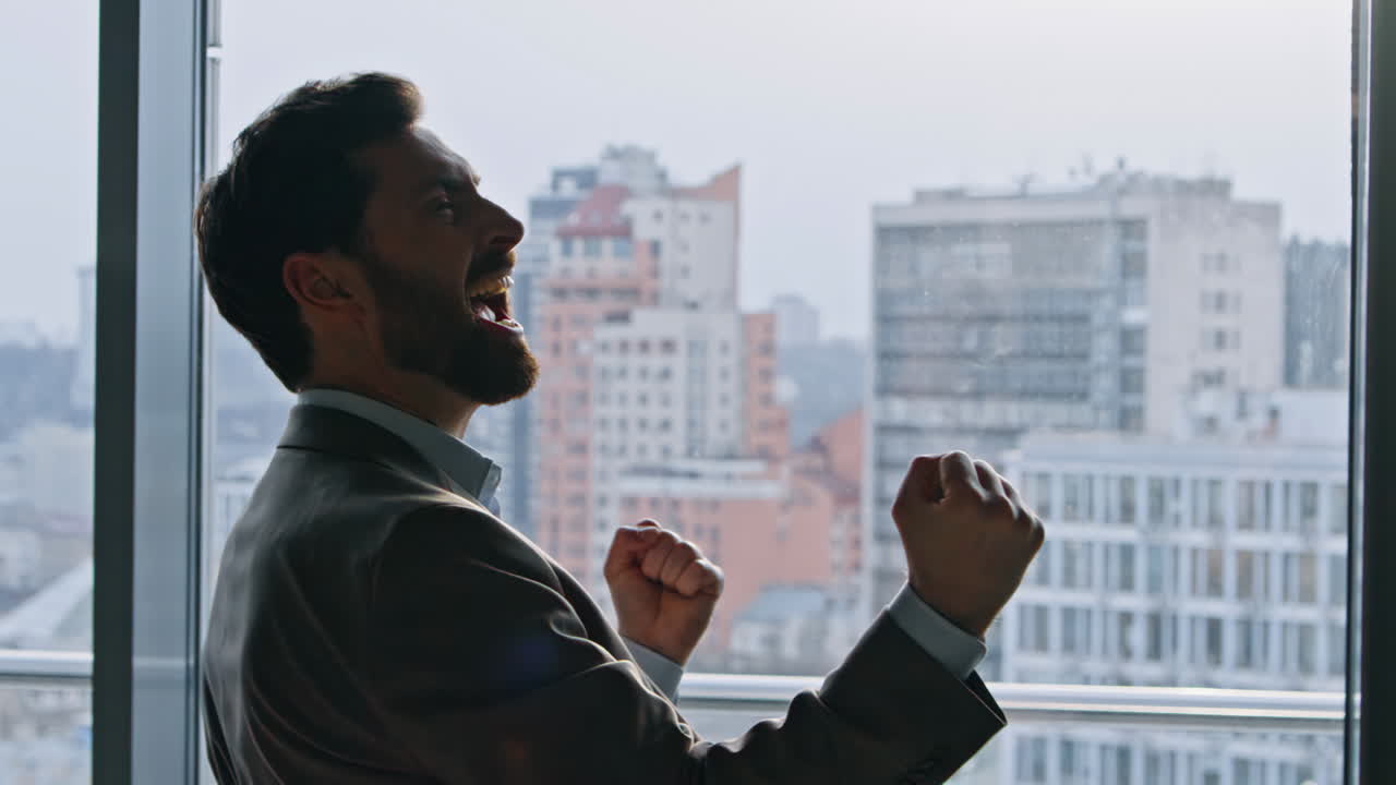 Victorious company leader gesturing proudly in transparent office space closeup