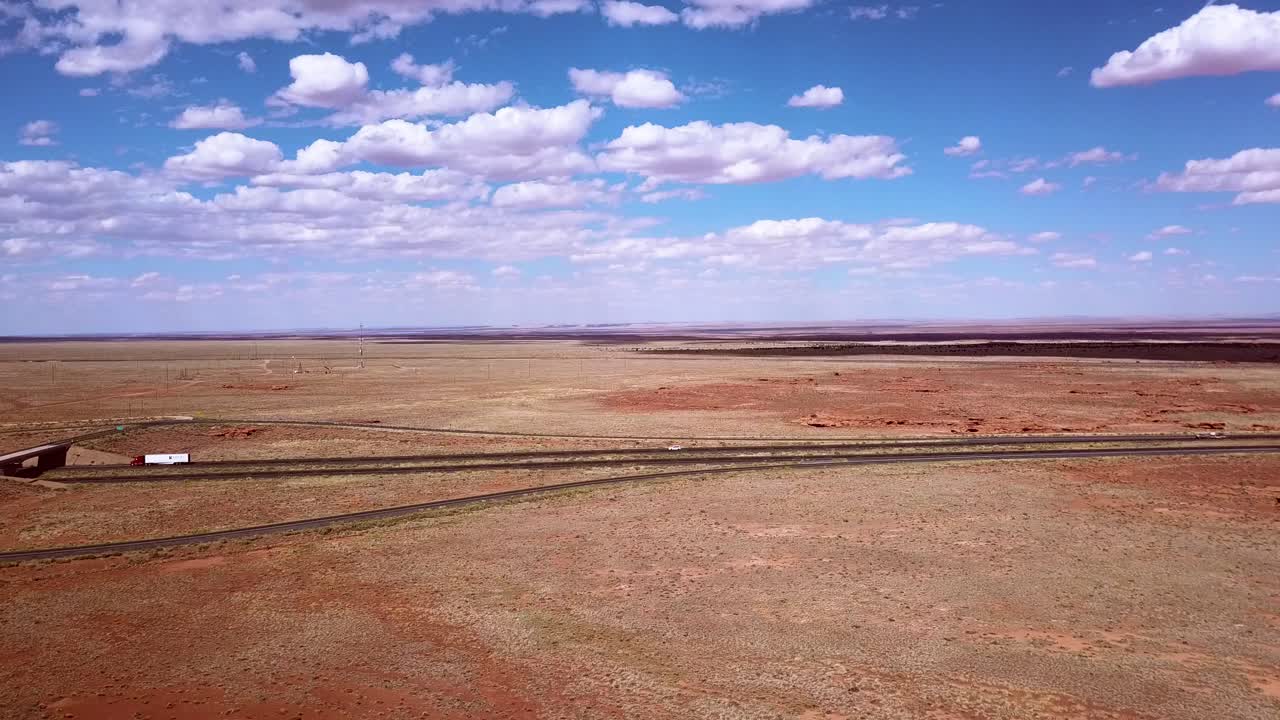Drone over the Arizona desert near Winslow with the i40 in the background.
