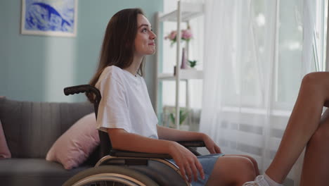 disabled woman smiles listening to fun stories of friend