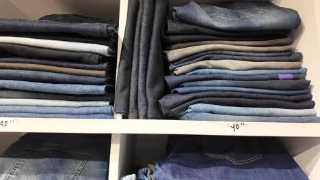 stacked jeans on shelves