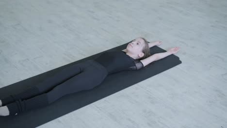 Young ballet girl at studio lesson. Training performance. Stretching exercise pose. Ballerina practice balance technique. Classical elegance fitness.