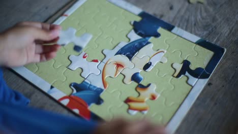 Toddler-girl-playing-puzzles-at-home