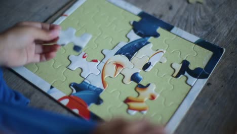 toddler girl playing puzzles at home