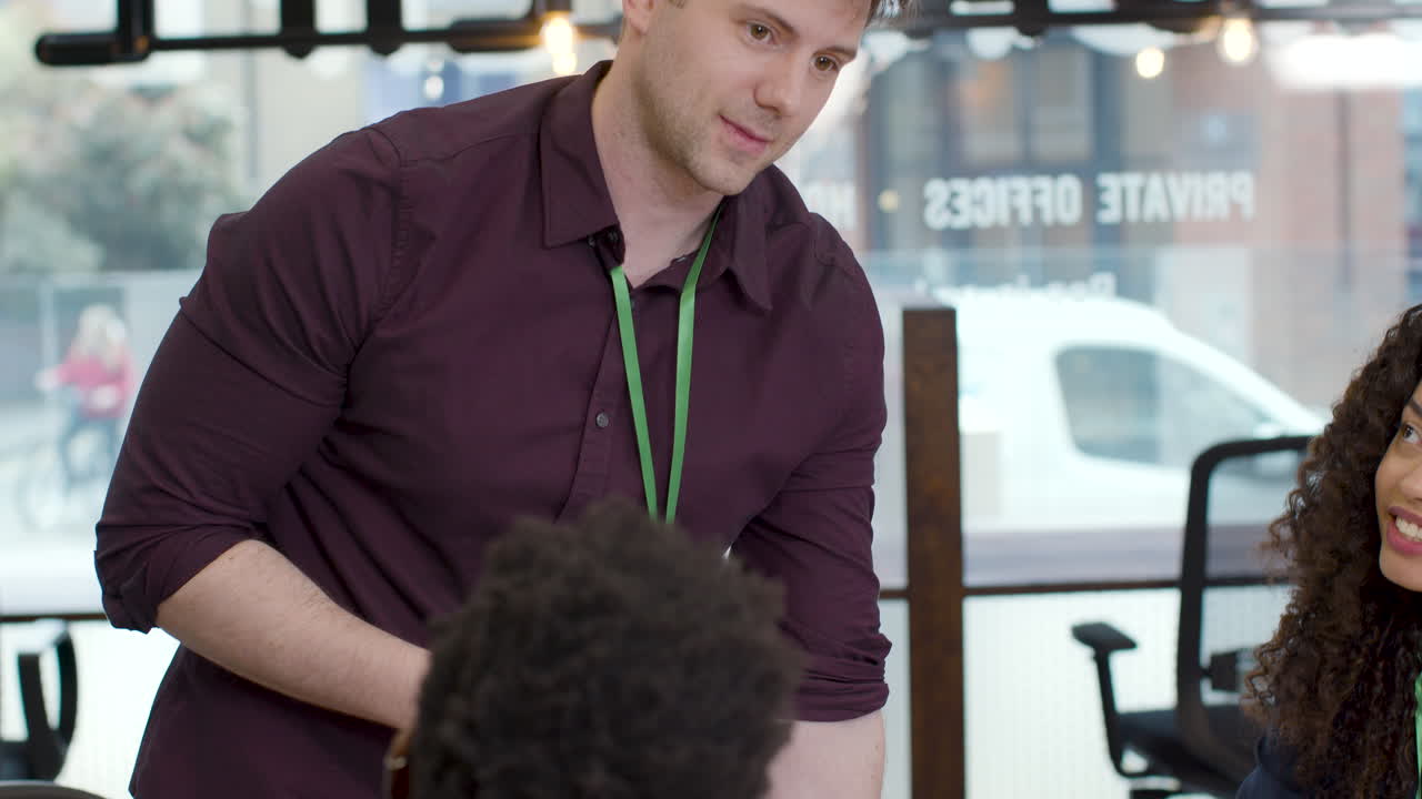 Businessman In Meeting With Colleague