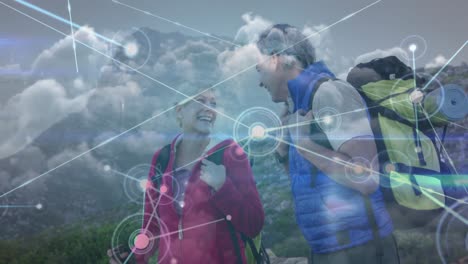 Happy-caucasian-senior-couple-hiking-in-countryside,-over-growing-network-of-connections