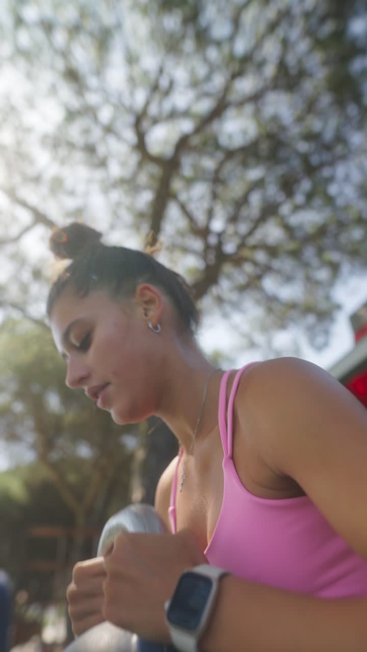 Woman Exercising Outdoors with a Kettlebell