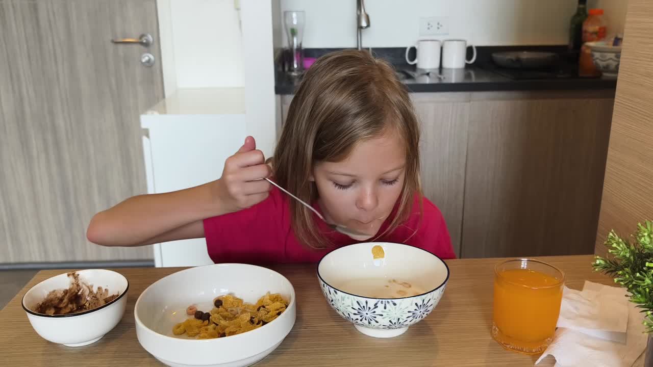 Girl eating cereal for breakfast