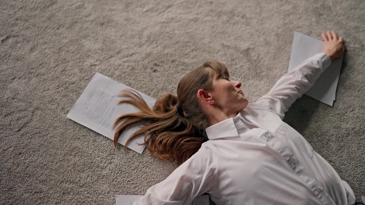 Woman Relaxing on the Floor with Papers