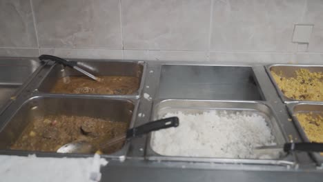 slow motion kitchen shot of rice