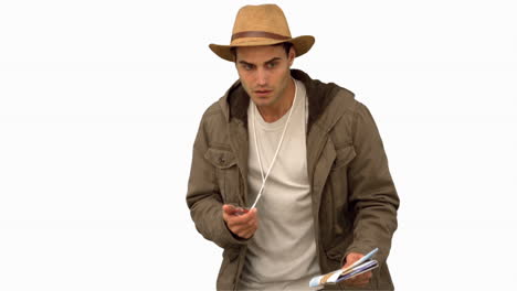 man orienteering with a map and a compass on white screen