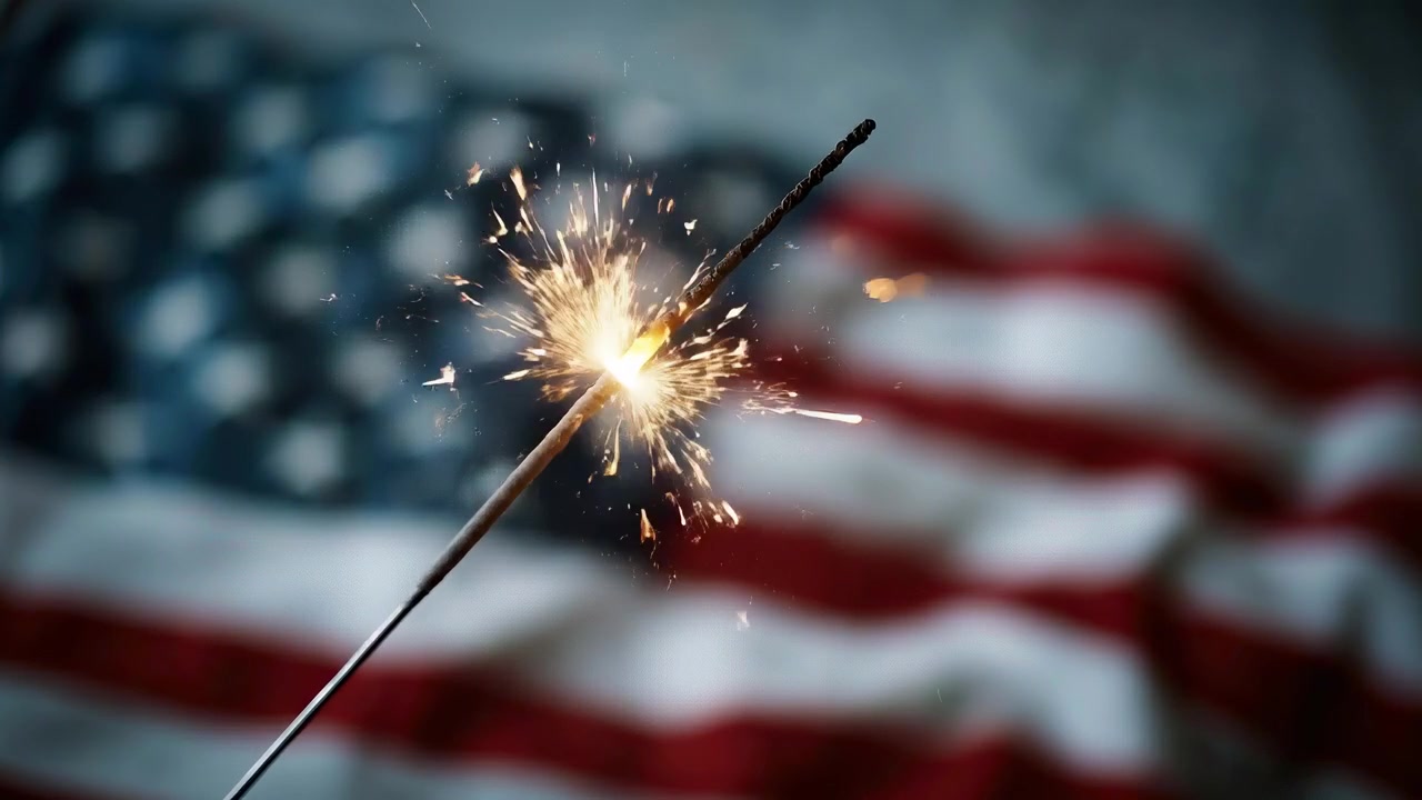 Sparkler Burning Brightly in Front of an American Flag