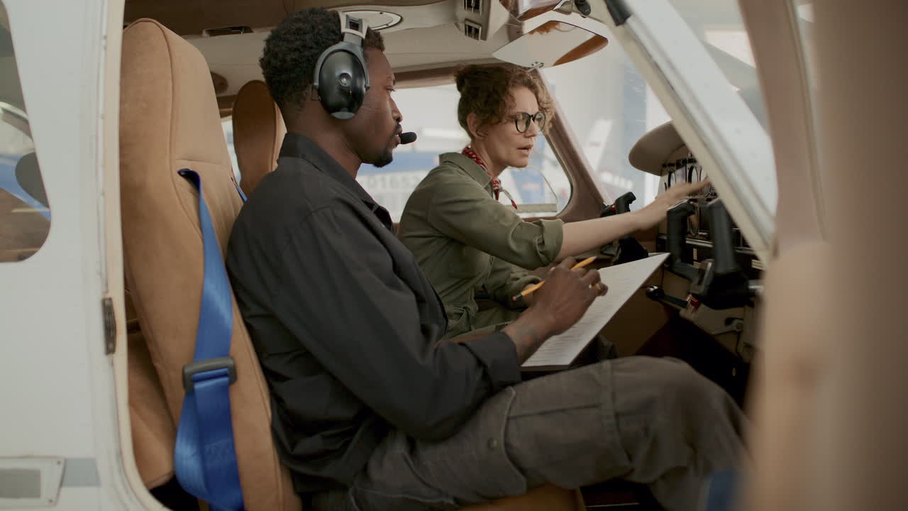Female Pilot Talking to Technician during Preflight Aircraft Check