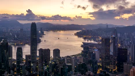 4k time-lapse : sunrise over victoria harbor at victoria peak, hong kong