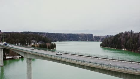 highway bridge over lake in winter landscape