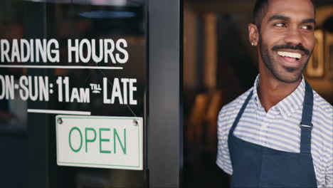 store employee opening the door