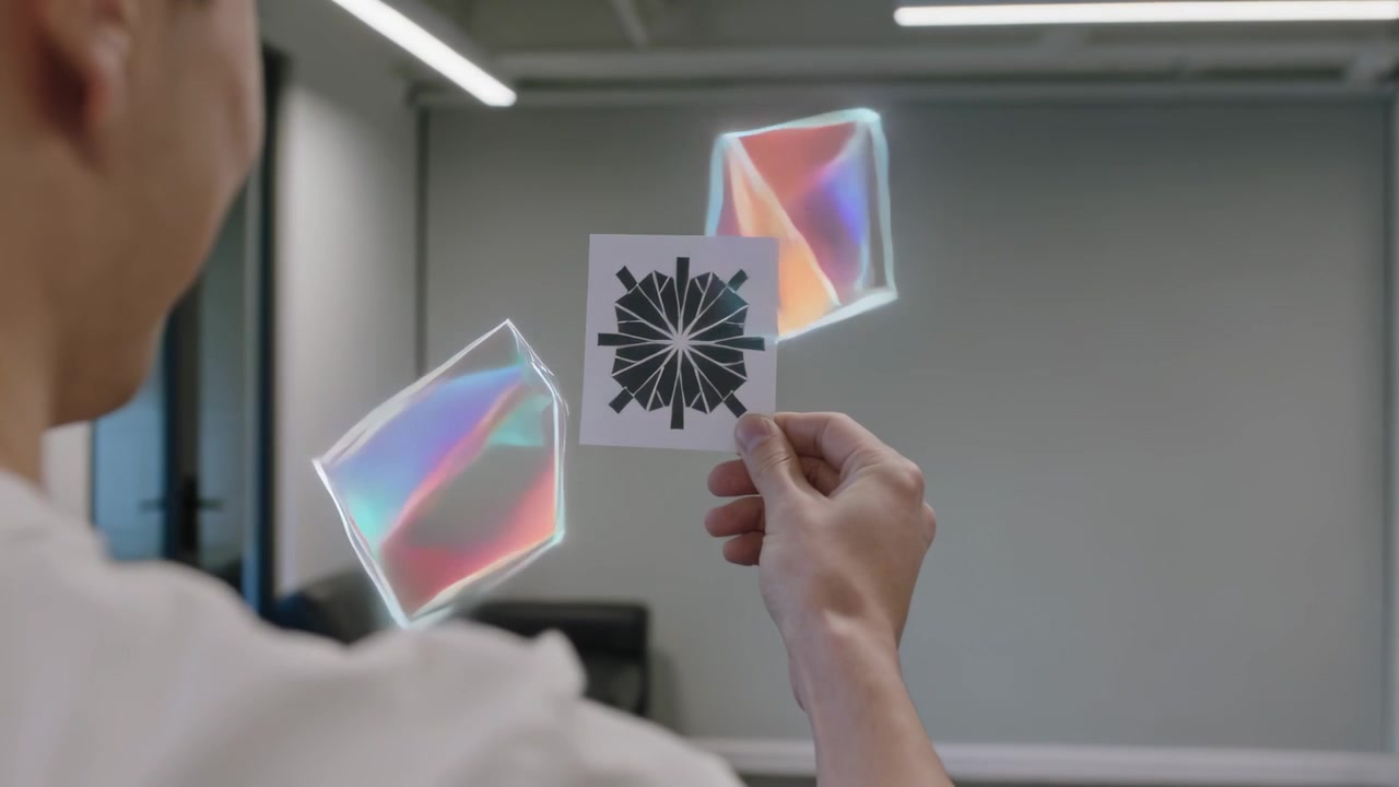 Holding Asian man in white tee adjusting patterned card in office, pattern causing hologram