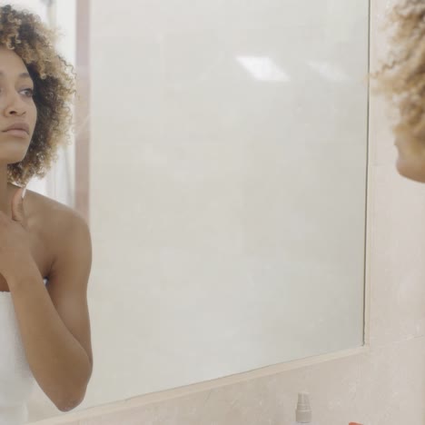 happy young woman looking on mirror