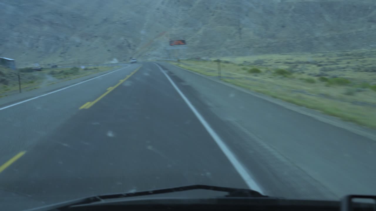 As seen through the window of an RV in summer 2020, mist mingles with ash and smoke in the Western United States sky