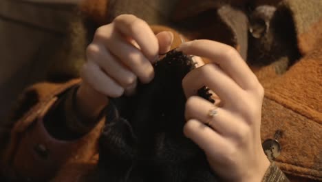 Knitting-a-Scarf---Close-Up-Hands-of-Unrecognizable-Female