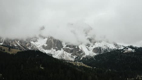 Slow-moving-aerial-shot-of-cloud-covered-mountains-in-Italy
