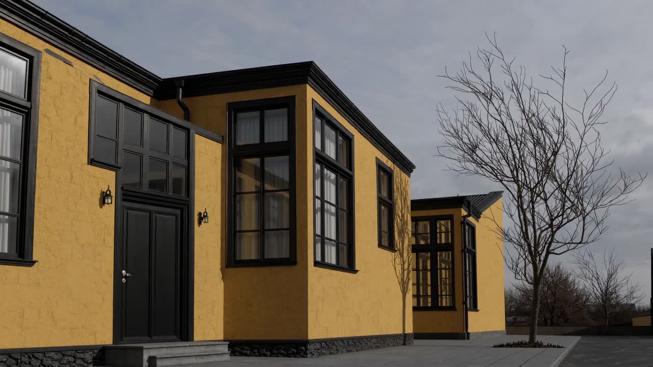 Modern yellow building featuring bold black window frames, complemented by a bare tree in the foreground, creating a striking contrast against a clear daytime sky