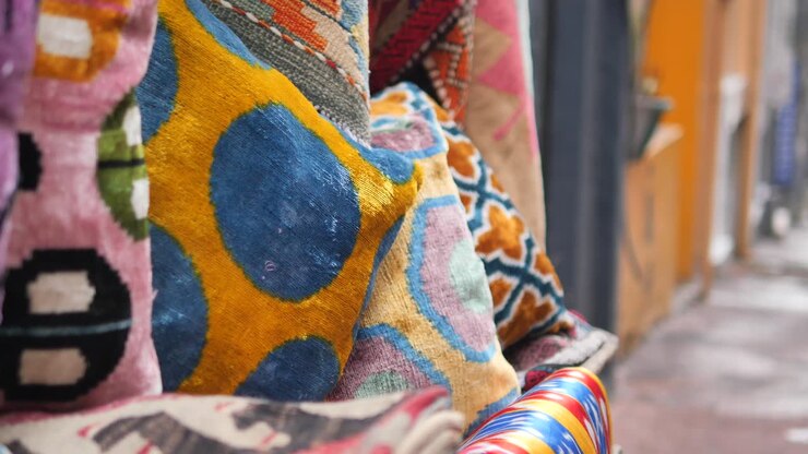 Close-Up of Colorful Traditional Fabrics on Display in an Outdoor Market