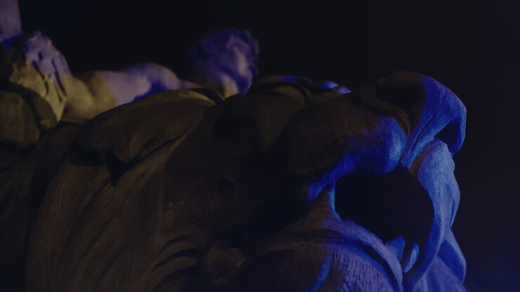 Epic, ancient stone statue at night