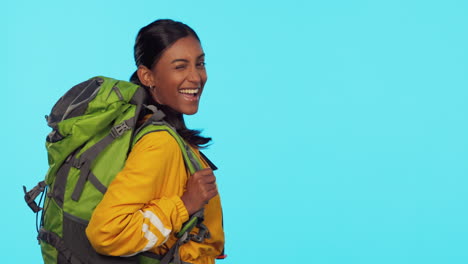 backpack, wink and woman face in studio