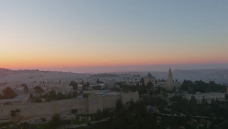 old city of jerusalem walls and dome of the rock at sunset, aerial view