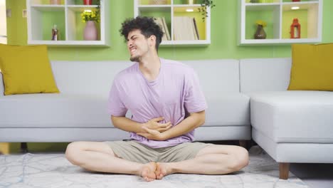 young man having stomachache.