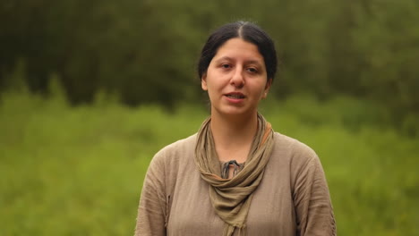 woman speaking outdoors in nature