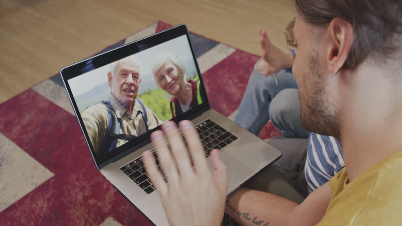 Same-Sex Family with Kid Talking to Grandparents on Video Call